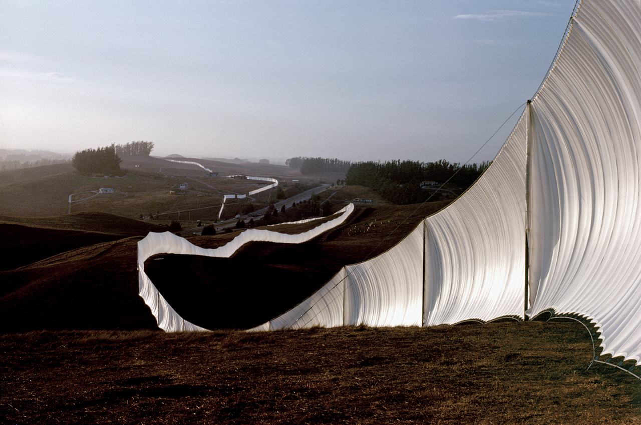 photo of Christo and Jean-Claude's artwork "Running Fence" weaving through the landscape
